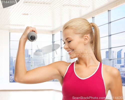 Image of close up of sporty woman flexing her bicep