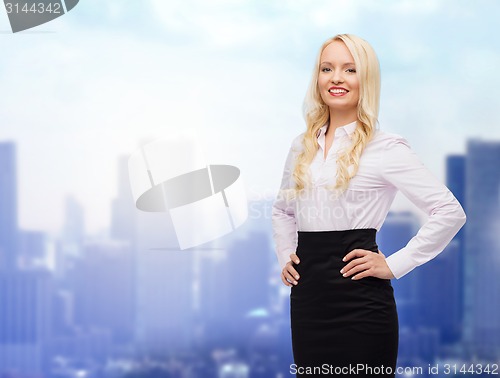 Image of smiling businesswoman or secretary over city
