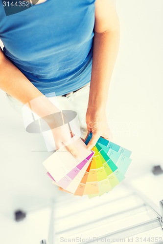 Image of woman working with color samples for selection