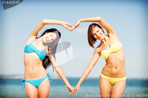 Image of girls having fun on the beach