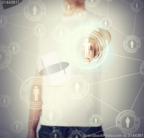 Image of businessman pressing button with contact