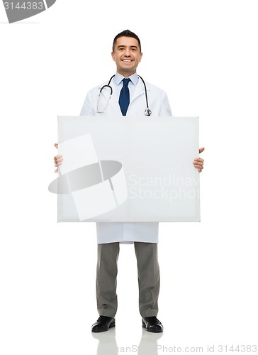 Image of smiling male doctor holding white blank board