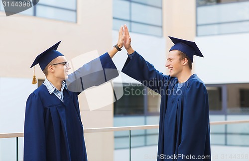 Image of smiling students in mortarboards