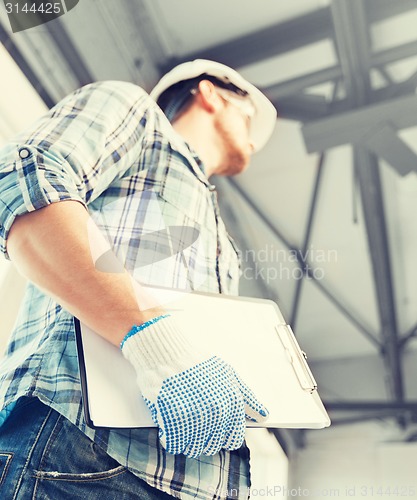 Image of man with blueprint