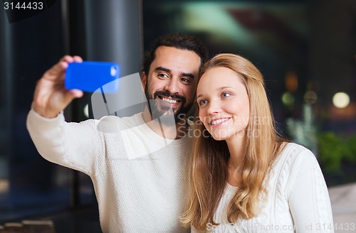 Image of happy couple with tablet pc and coffee at cafe