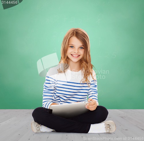Image of happy little student girl with tablet pc