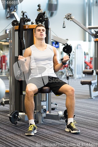 Image of man exercising on gym machine