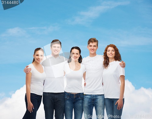 Image of group of smiling teenagers in white blank t-shirts