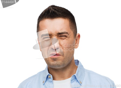 Image of man wrying of unpleasant smell