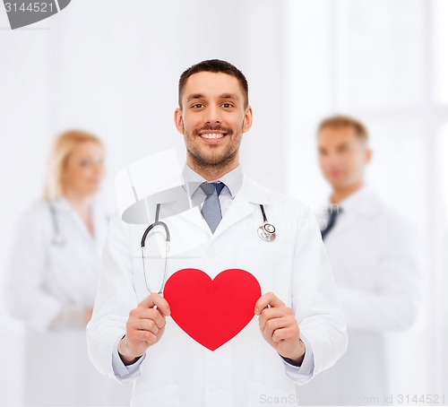 Image of smiling male doctor with red heart