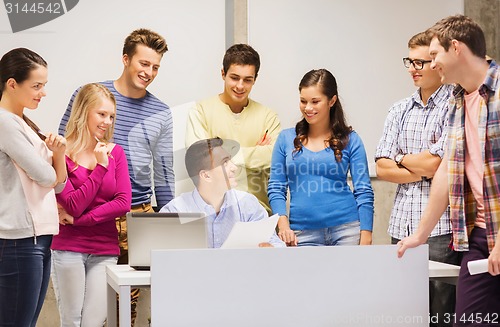 Image of group of students and teacher with laptop