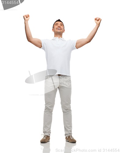 Image of happy man with raised hands