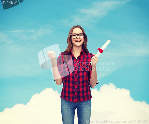 Image of smiling female student in eyeglasses with diploma