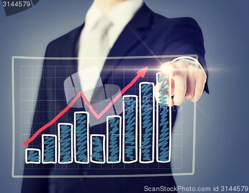 Image of businessman hand with chart on virtual screen