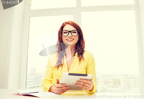 Image of smiling businesswoman or student with tablet pc