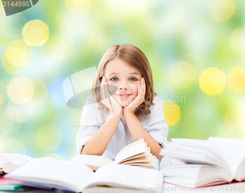 Image of happy student girl with books at school