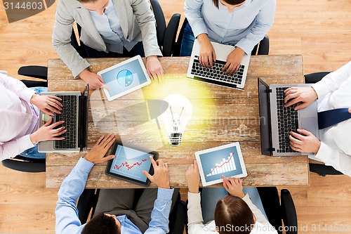 Image of business team with laptop and tablet pc