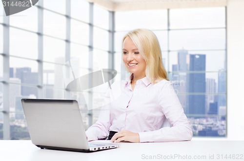 Image of smiling businesswoman or student with laptop