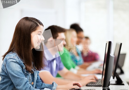 Image of students with computers studying at school