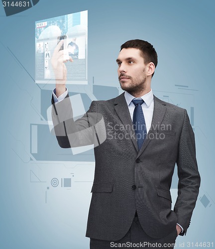 Image of young businessman with smartphone