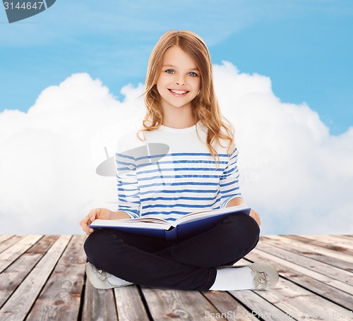 Image of student girl studying and reading book