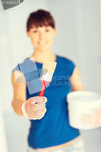 Image of woman with paintbrush and paint pot