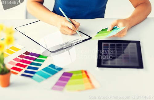 Image of woman working with color samples for selection