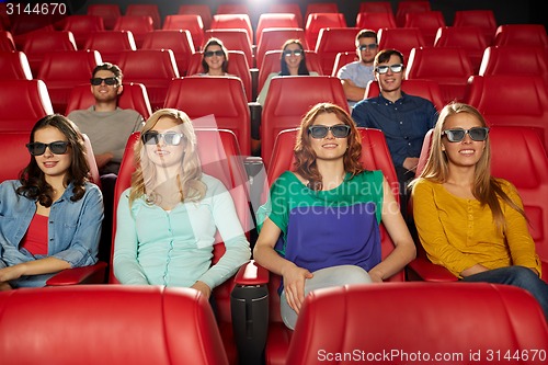 Image of happy friends watching movie in 3d theater