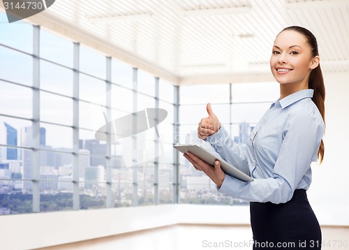 Image of smiling businesswoman or student with tablet pc