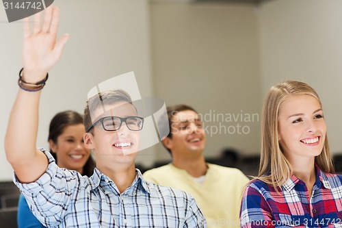 Image of group of smiling students in lecture hall