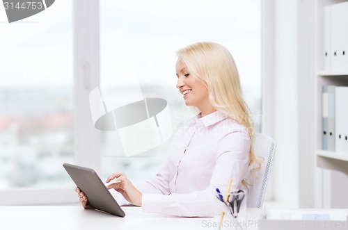 Image of smiling businesswoman or student with tablet pc