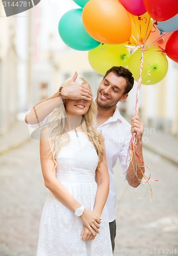 Image of couple with colorful balloons