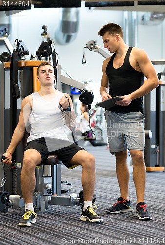Image of man exercising on gym machine