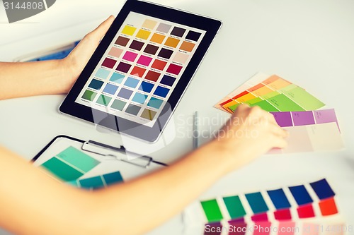 Image of woman working with color samples for selection