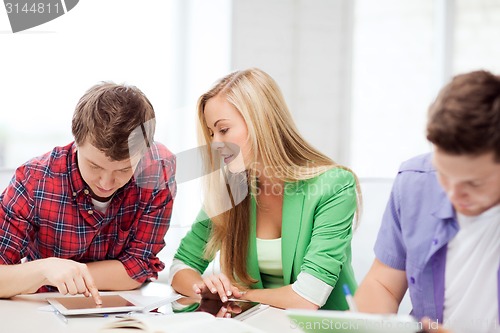 Image of students browsing in tablet pc at school