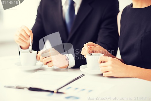 Image of woman hand signing contract paper