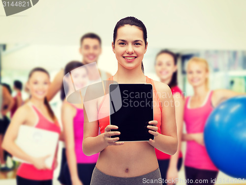 Image of sporty woman with tablet pc blank screen