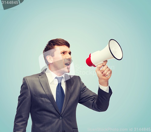 Image of buisnessman with bullhorn or megaphone