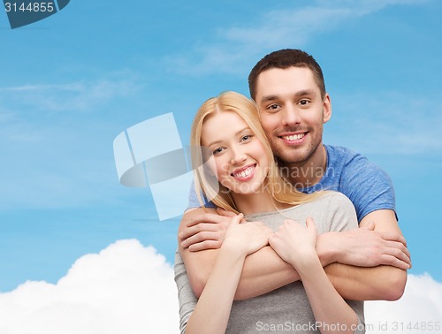 Image of smiling couple hugging