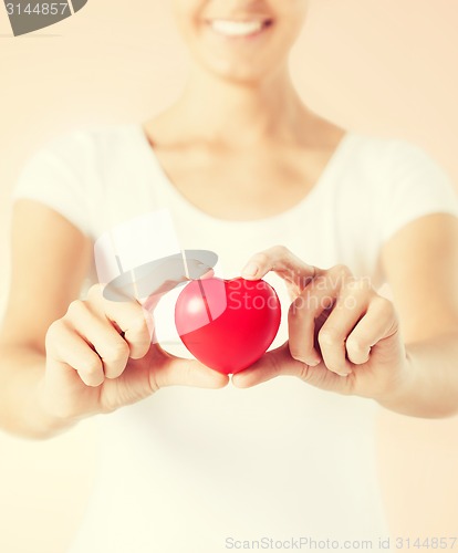 Image of woman hands with heart