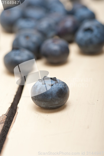 Image of fresh blueberry on white wood table