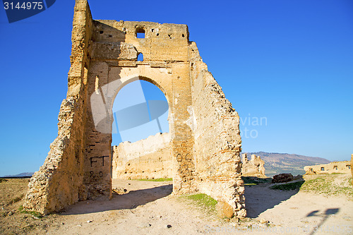 Image of   arch in africa old construction street  blue sky