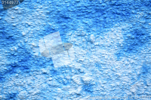 Image of blue  in texture wall and   