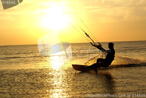 Image of Kitesurfing and sunset