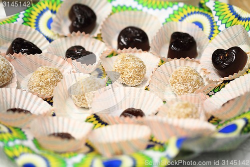 Image of coconut spheres and chocolate dessert