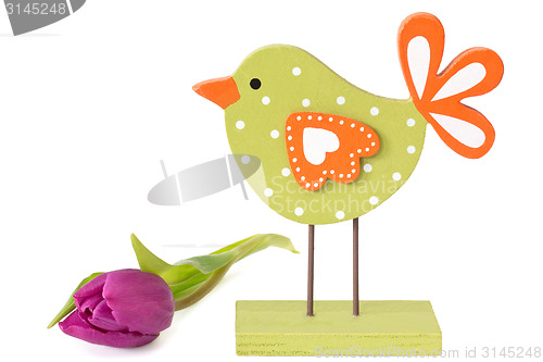 Image of Wooden bird with tulip