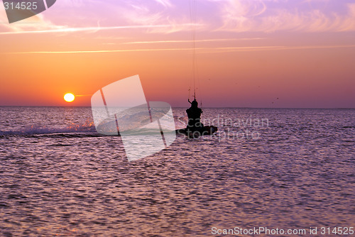 Image of Kitesurfing and sunset