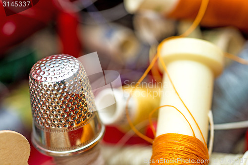 Image of Thimble with thread