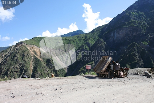 Image of People fixing a tractor in Tibet