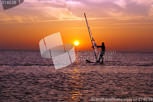 Image of Windsurfing and sunset